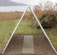Concrete in the anchors if you wish. For a clean surface for shoes and fallen
clothes, perhaps make a path of 4 x 600 x 600 slabs with a membrane under gravel within
garden edging to stop weeds.